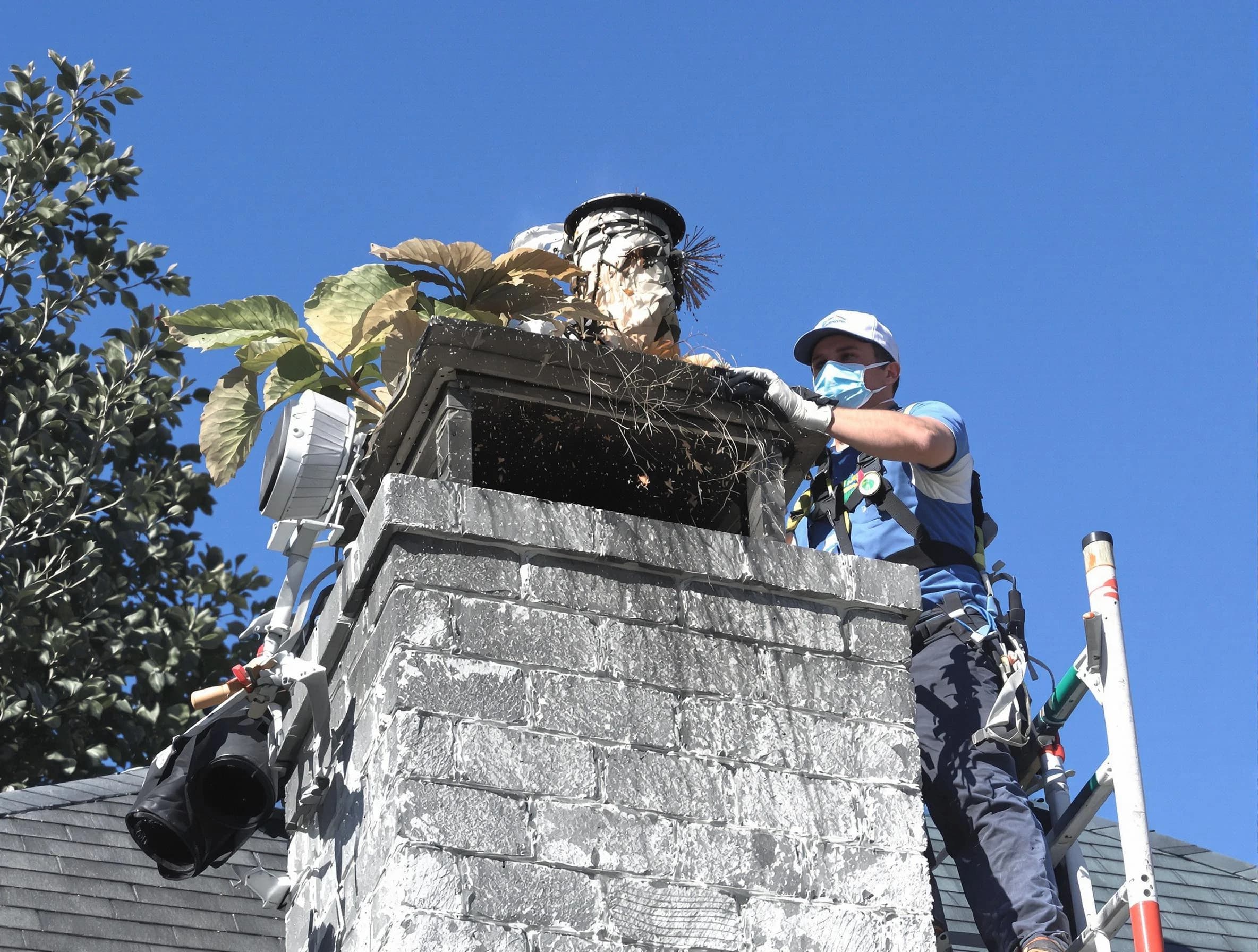 Piscataway Chimney Sweep specialist performing chimney cleaning in Piscataway, NJ